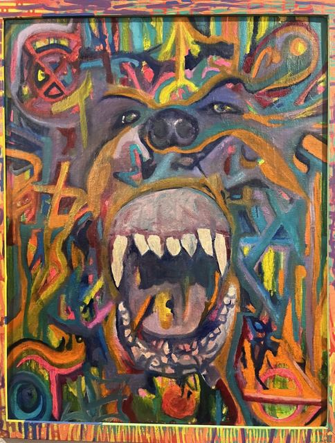 A snarling bear with huge fangs inside a riot of colored marks
