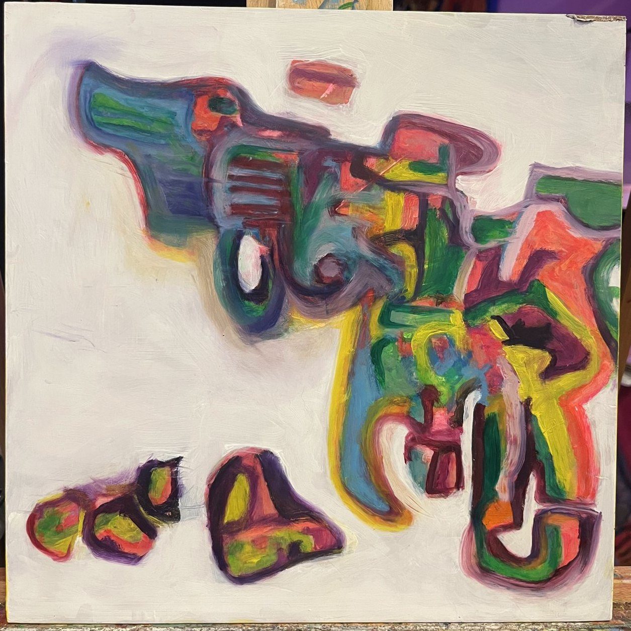 A revolver drawn in layered rainbow outlines on white