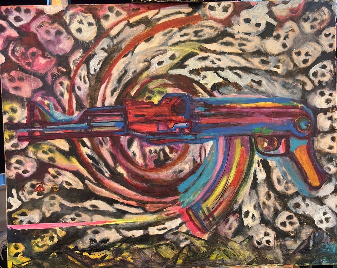 A rainbow AK-47 across a swirling red and white spiral packed with skulls